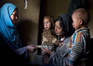 Community health worker discusses family planning with mother of five in Afghanistan. (Photo courtesy of Jhpiego.) Community health worker discusses family planning with mother of five in Afghanistan. (Photo courtesy of Jhpiego.)